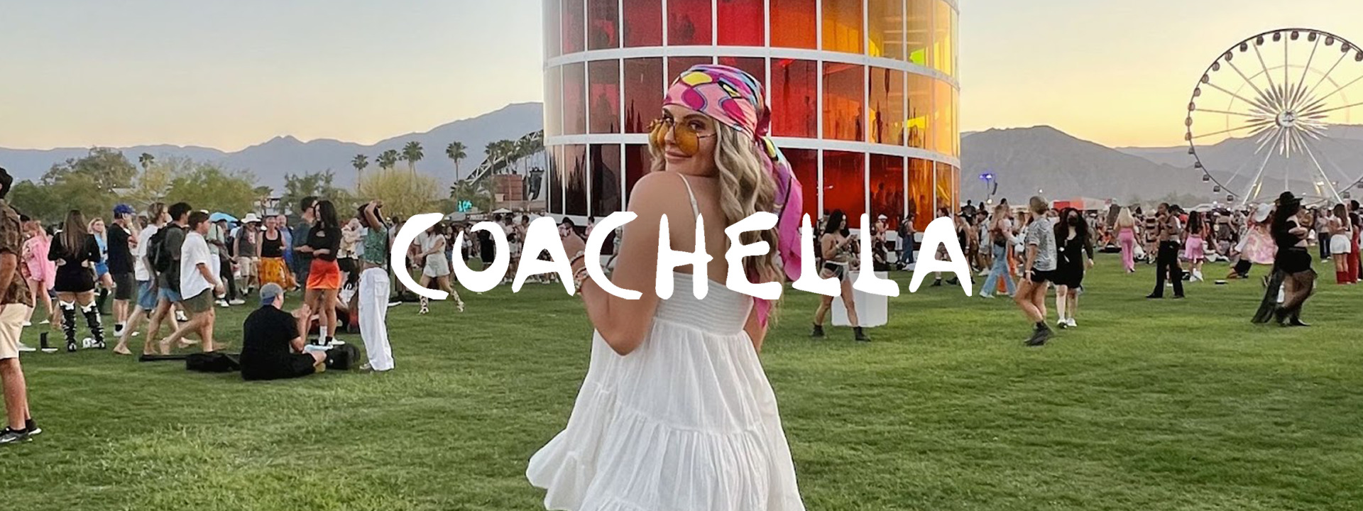 Rachel Ward social media manager at Kiosk standing in front of Coachella ferris wheel in Palm Springs California